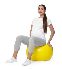 Beautiful pregnant woman doing exercises on fitball against white background