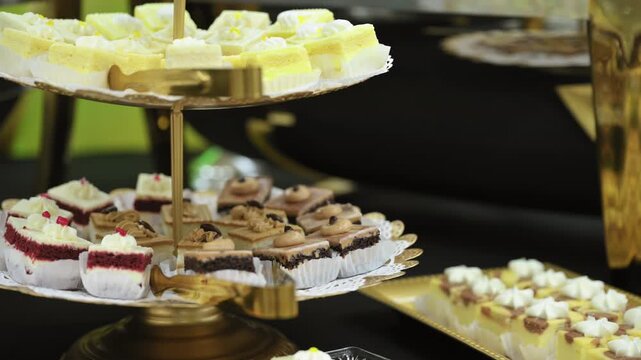 Close up view of Candy bar, stands. Delicious desserts at the banquet, sponge cakes, shortbread tarts. move camera footage. 