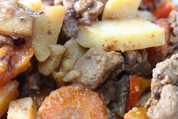 meat vegetables. meat with carrots and potatoes. meal details. food with selective focus.