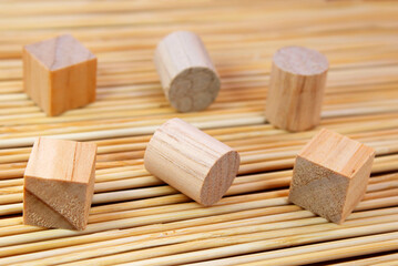 Wooden geometric figures, cubes and cylinders