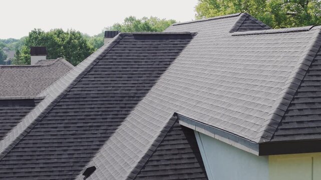 Aerial footage of new roof is installed on a private house. Day time