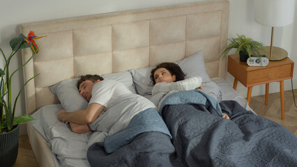 Boyfriend girlfriend lying bed bedroom home turn away sleep female male guy girl relationship...