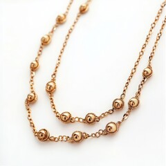 Fototapeta premium Elegantly crafted gold necklace with intricate bead details, perfect for adding a touch of sophistication to any outfit.