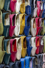 Traditional turkish leather shoes named yemeni. Colorful handmade leather slipper shoes displayed on the street market in Turkey.