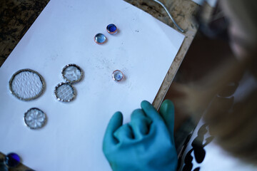 Stained glass workshop. Table with pieces of glass and necessary tools. 