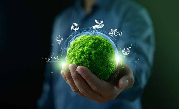 Businessman holding the green world for the Sustainable Development Goals. Corporate social responsibility CSR. World Environment Day. Responsibility for the environment. Save and protect the world.