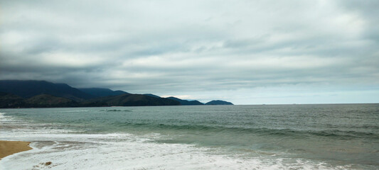 Sea river water beach cove ocean wave sand land stone rock mountain hill forest tree flowers bushes vegetation blue sky cloudy cloud horizon landscape island vacation surfing sport life nature