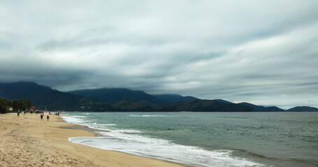 Sea river water beach cove ocean wave sand land stone rock mountain hill forest tree flowers bushes vegetation blue sky cloudy cloud horizon landscape island vacation surfing sport life nature