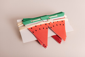 Festive watermelon-themed party decorations laid out on a white background.