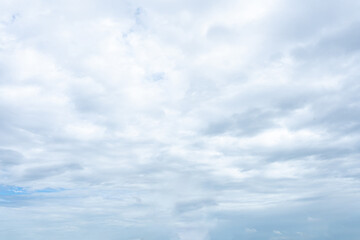 Bright blue sky with fluffy white clouds on a sunny summer day