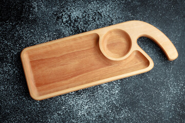 The sideboard is made of wood for serving snacks, fruits, nuts, cheeses, meats and original serving of main dishes. Luxury products from hard and exotic wood species. Accessories for a modern kitchen.