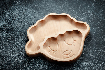 A plate for children in the shape of a lamb is made of wood for serving snacks, fruits, nuts, cheeses, meat and original serving of main dishes. Accessories for a modern kitchen.