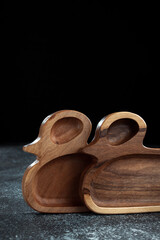 The children's plate in the shape of a duck is made of wood for serving snacks, fruits, nuts, cheeses, meat and original serving of main dishes. Accessories for a modern kitchen.