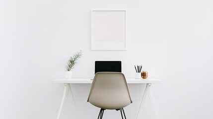 A minimal office setup with a white desk, a streamlined chair, and a laptop, with no clutter, set against a white wall with a single piece of art.
