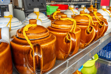 Teapots on a shelf in a restaurant