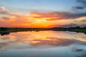 A stunning sunrise, beginning in its golden hour splendor.