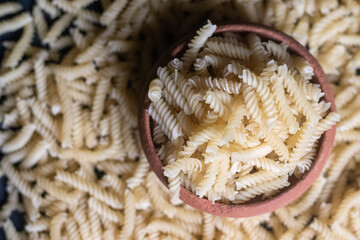 Uncooked pipe spiral pasta background