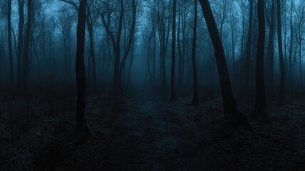 Fototapeta premium Eerie, foggy forest at dusk with silhouettes of bare trees