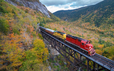 Scenic train at Trestle bridge in North Conway in Autumn, New Hampshire, USA © eFlexion