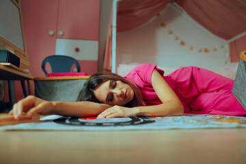 Tired Mother Sleeping on the Floor on her Kids Room. Sleepy mom trying to have some resting moments...
