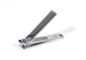 Silver nail clippers isolated on white background. Tools for manicure and pedicure care.