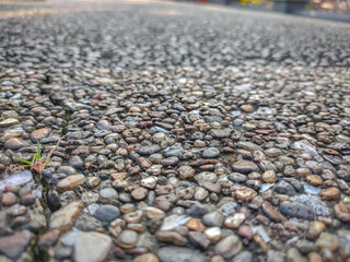 the texture of natural stone used as a wall in a garden