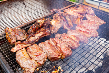 Chilean celebration of the national holidays where you eat chilean asado, roasts, meats and chickens that are eaten on fire as part of the traditions of Chile