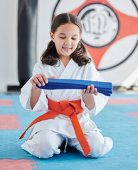 Martial arts, belt and girl in studio for fitness, training and fight with discipline, development...
