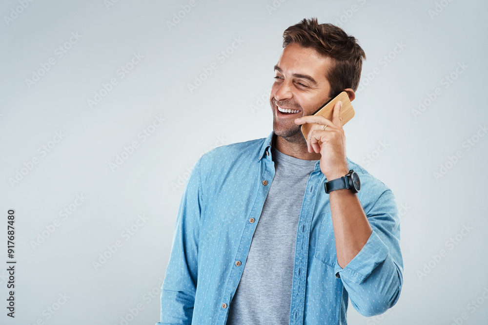 Poster Phone call, laughing and smile with man in studio on white background for communication or conversation. Contact, funny and thinking with happy person speaking on mobile for chatting or networking