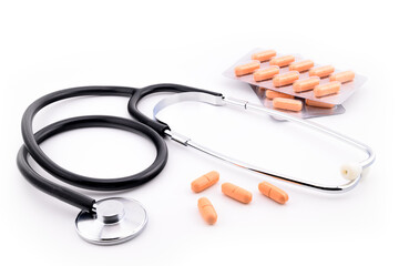 stethoscope and tablets in blister