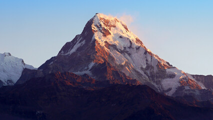 Annapurna South, magical Nepalese mountain in red morning light