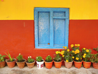 Colorfully painted wooden window in a Sherpa lodge in the Himalayas