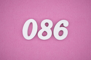  The numbers are made of white painted wood. Laying on the floor was pink paper.