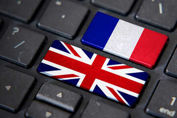 UK and France flags on computer keyboard