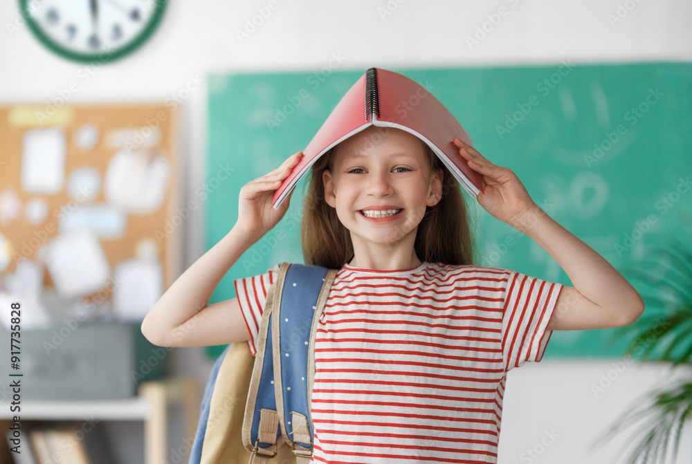 Wall mural girl with backpack indoors