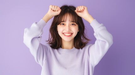 Fototapeta premium Happy woman posing with raised fists