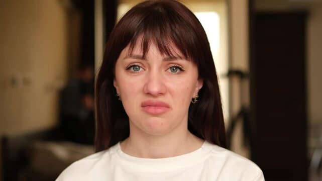 Young brunette shows emotions of disgust