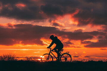 Obraz premium silhouette of a person riding a bike