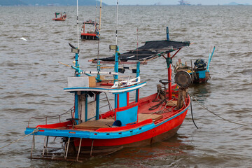 Small fishing boats at Wonnapa Beach, Bangsaen, Chonburi, Thailand.