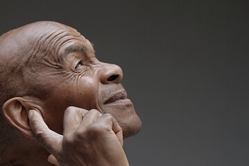deaf man suffering from deafness and hearing loss on grey background with people stock image stock photo	