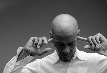 deaf man suffering from deafness and hearing loss on grey background with people stock image stock...