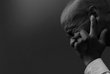 deaf man suffering from deafness and hearing loss on grey background with people stock image stock...