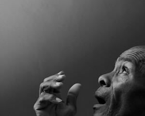 man praying to god with hands together Caribbean man praying with black grey background with people stock image stock photo	