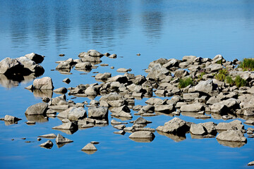 Water gets low and stones in a river get visible