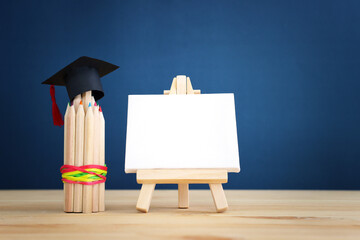 Back to school or education concept. graduation hat on pencils