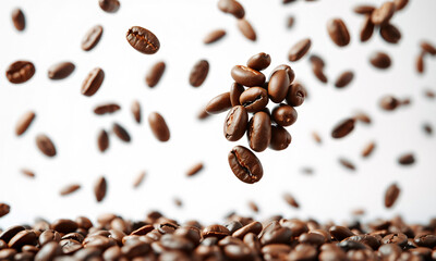 Obraz premium coffee beans are suspended in mid-air, appearing to float or fly against a crisp, white background