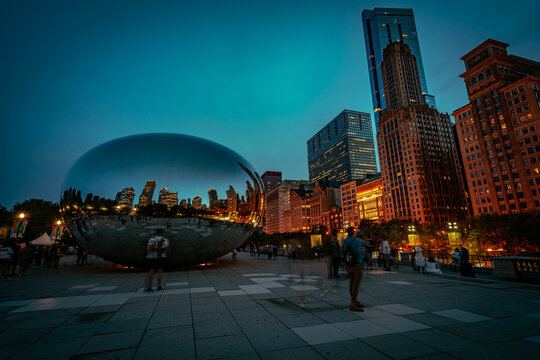 Chicago, Illinois, USA - Aug 15, 2019: Cloud Gate sculpture in Millennium park in the evening
