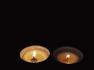 Scented candles in the dark at night for a spa or relaxation background.