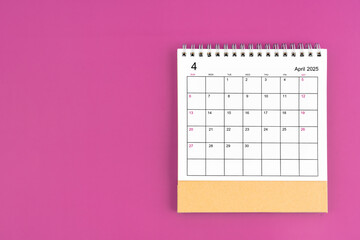 April 2025, Monthly desk calendar for 2025 year on purple background.