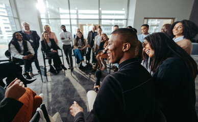 Group of happy and attentive people enjoying interactive conference session